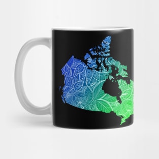 Colorful mandala art map of Canada with text in blue and green Mug